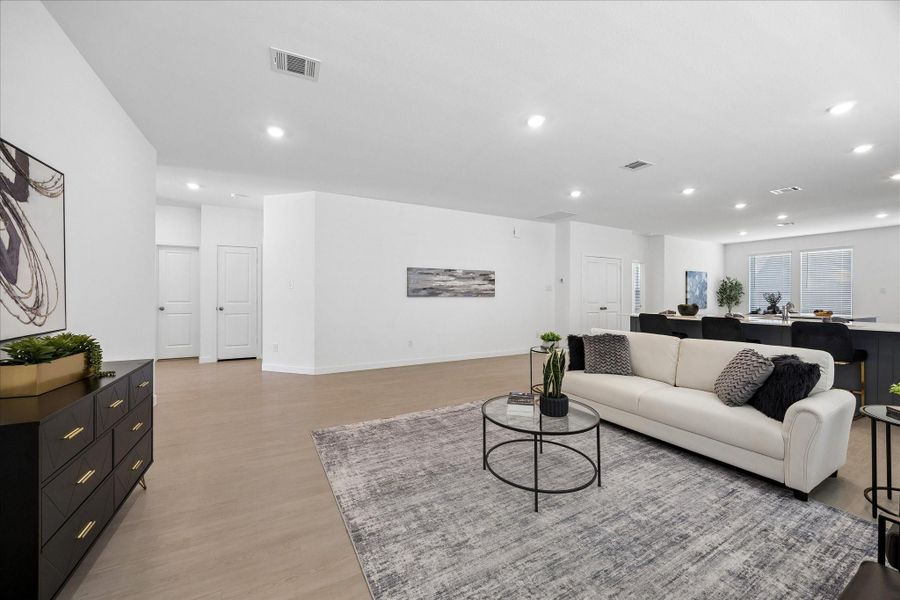 This family room gives you plenty of space to live a little larger, with fresh neutral finishes, LVP flooring and an open layout that easily handles everything from the peace and quiet of an evening in to the happy chaos of a full house.