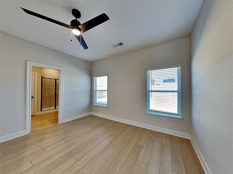 Spare room with ceiling fan and light hardwood / wood-style flooring