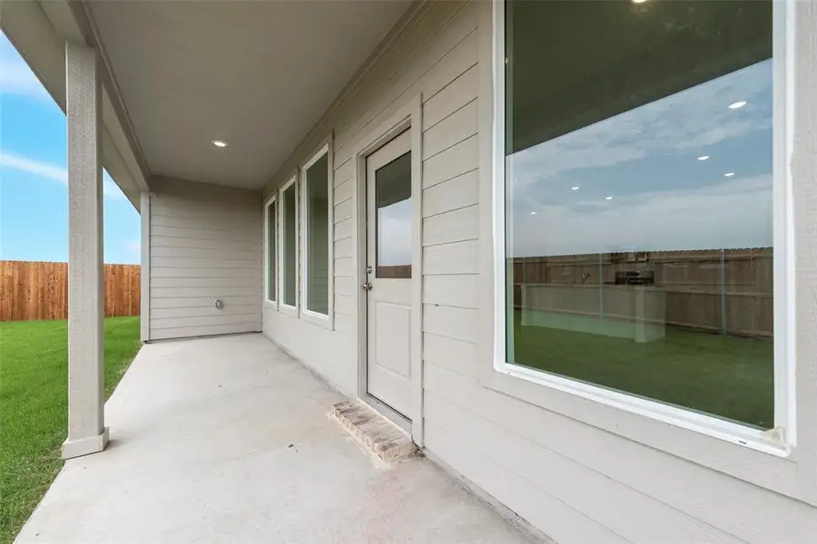 Exterior details and patio area of a home in Reatta Ridge: Classic Collection, Justin (Image 2). Exterior details and patio area of a home in Reatta Ridge: Classic Collection, Justin (Image 2).