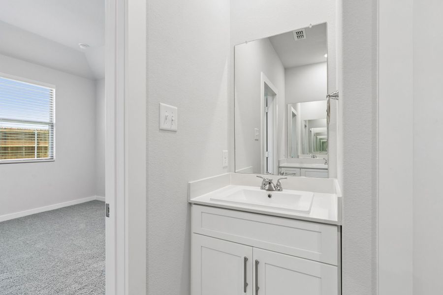 Primary Bathroom in the Cypress home plan by Trophy Signature Homes - REPRESENTATIVE PHOTO