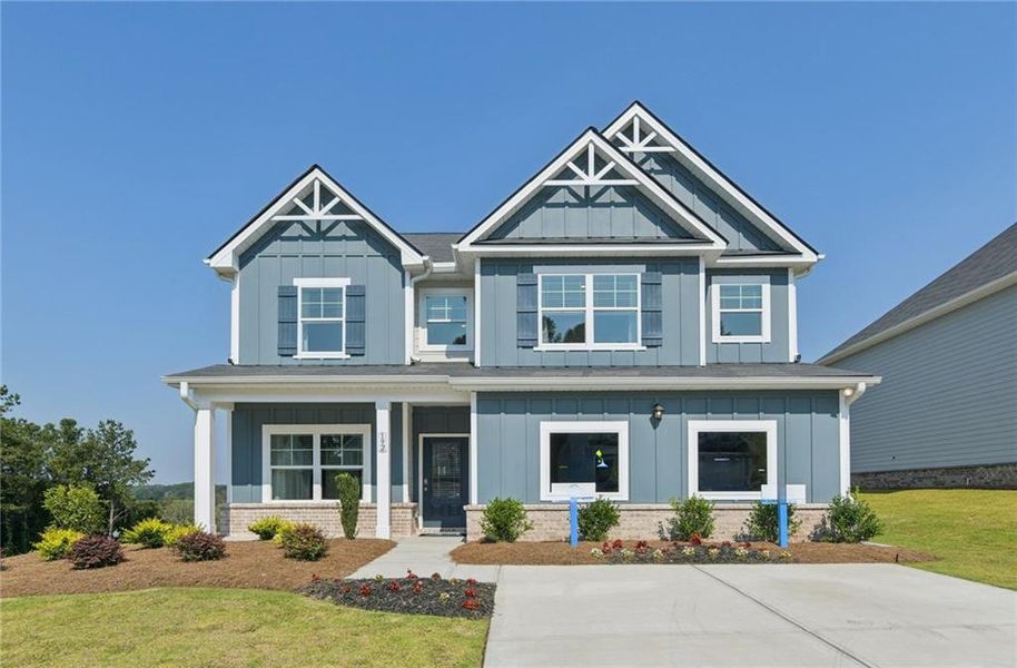 Front exterior of a new home in The Hills at Cedar Creek, Winder, GA, highlighting curb appeal (Image 2). Front exterior of a new home in The Hills at Cedar Creek, Winder, GA, highlighting curb appeal (Image 2).