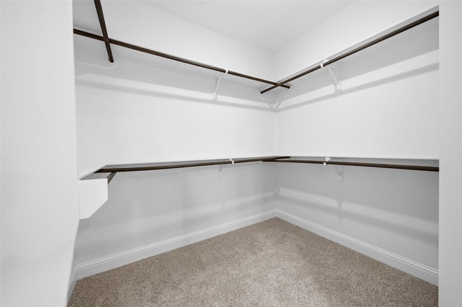 Primary walk-in closet.