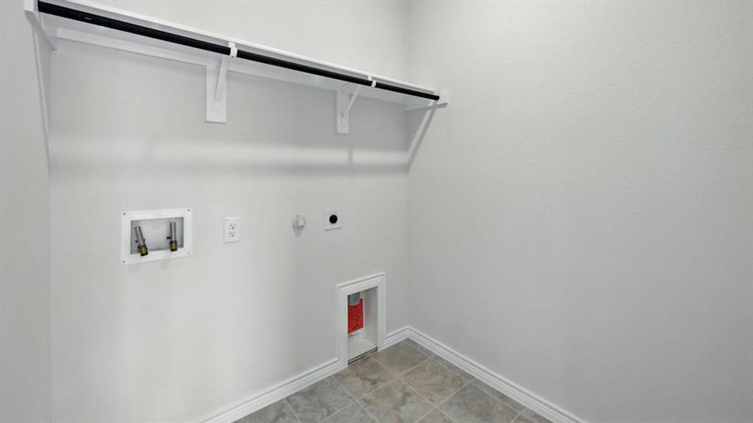 Washroom featuring gas dryer hookup, hookup for a washing machine, and hookup for an electric dryer