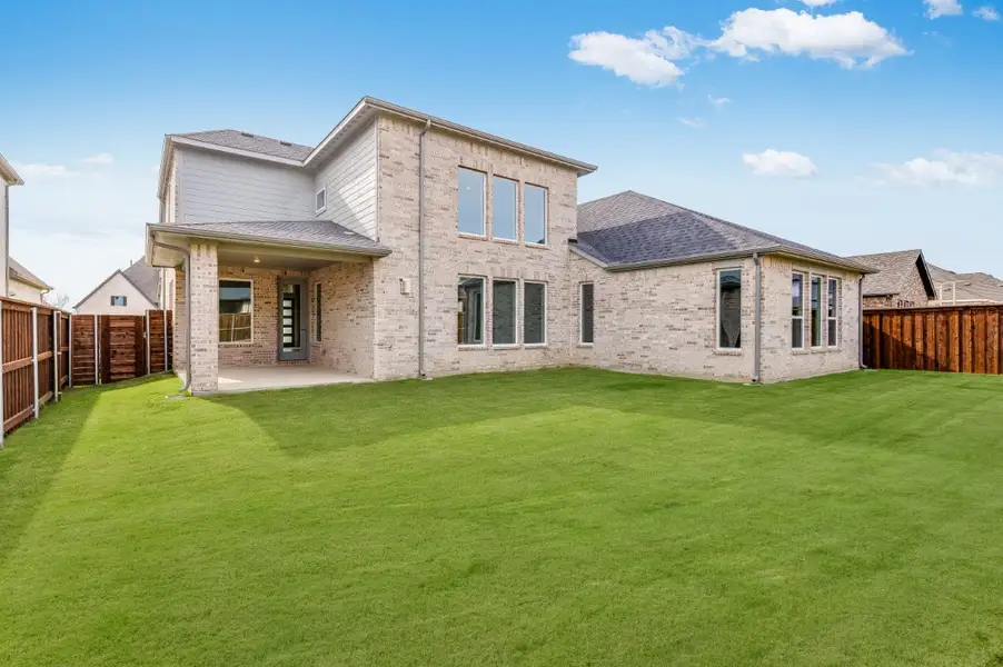 Representative exterior photo of a completed home built from the Amber by Taylor Morrison in Highland Lakes 60s, McKinney, TX (Image 2). Representative exterior photo of a completed home built from the Amber by Taylor Morrison in Highland Lakes 60s, McKinney, TX (Image 2).