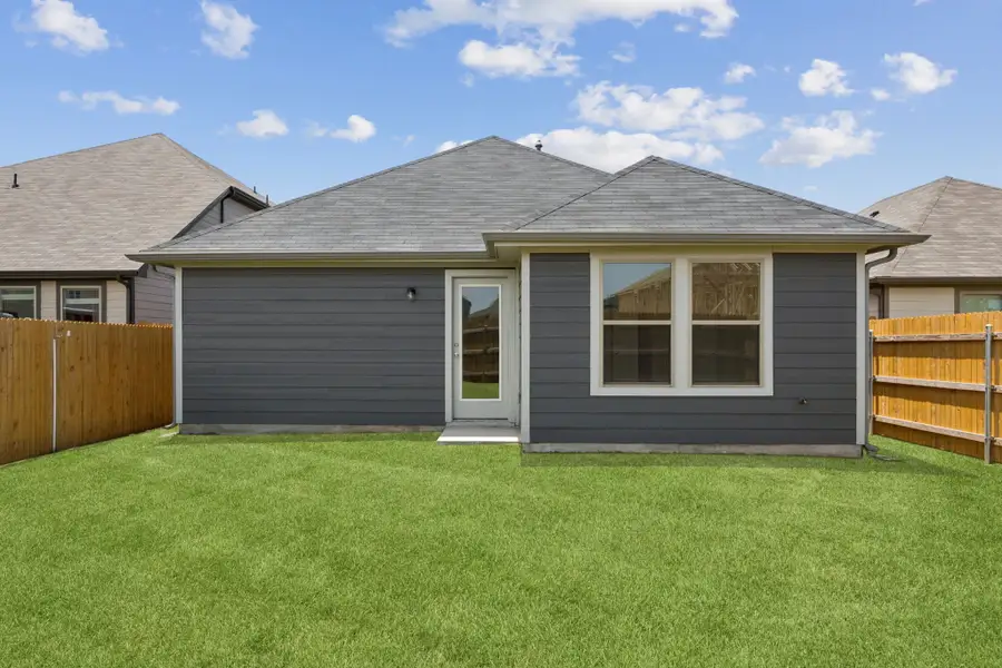 Yard in the Cypress home plan by Trophy Signature Homes - REPRESENTATIVE PHOTO