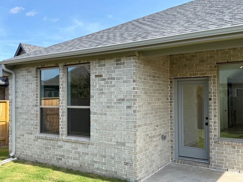 Exterior details and patio area of a home in Meridiana 40', 65', Iowa Colony (Image 2).