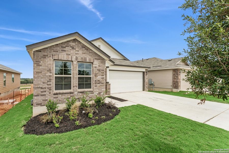 Front exterior of a new home in Mesquite Ridge, San Antonio, TX, highlighting curb appeal (Image 20). Front exterior of a new home in Mesquite Ridge, San Antonio, TX, highlighting curb appeal (Image 20).