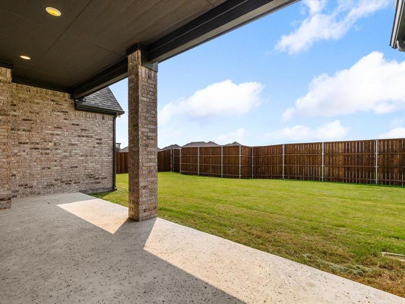Fenced backyard with a patio Fenced backyard with a patio