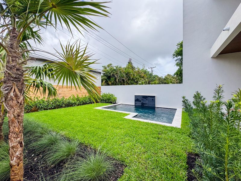 (as of April 8, 2026) west-facing backyard with privacy wall, 11x14 spa pool, and well landscaped