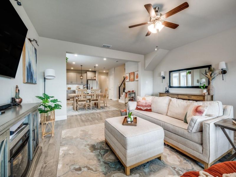 Open-concept living room offers a seamless flow into the kitchen and dining area.