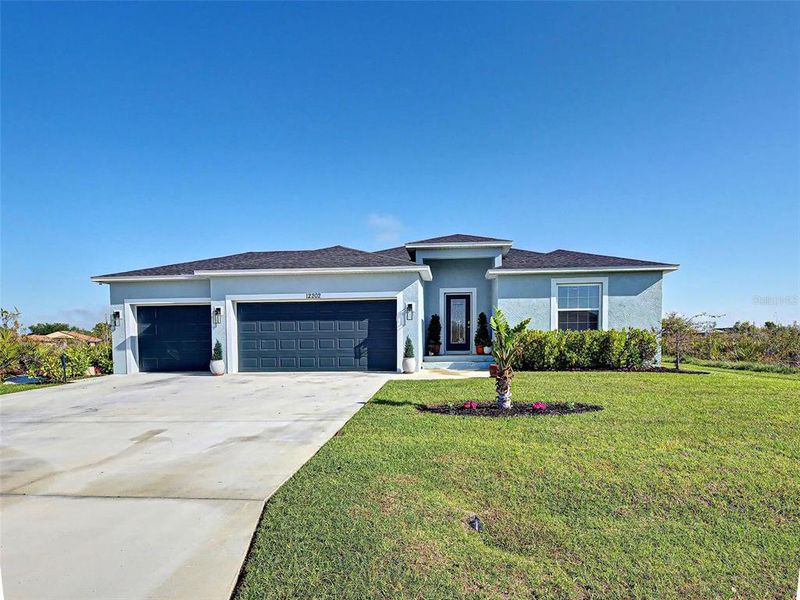 Front exterior of a new home in , Port Charlotte, FL, highlighting curb appeal (Image 2). Front exterior of a new home in , Port Charlotte, FL, highlighting curb appeal (Image 2).