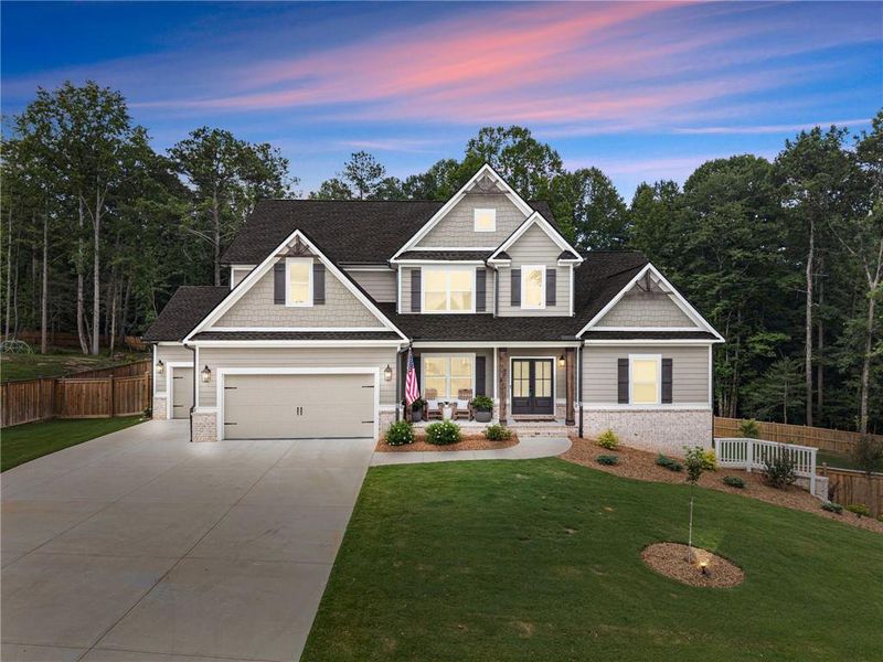 Front exterior of a new home in Woodland Hills, Loganville, GA, highlighting curb appeal (Image 31). Front exterior of a new home in Woodland Hills, Loganville, GA, highlighting curb appeal (Image 31).