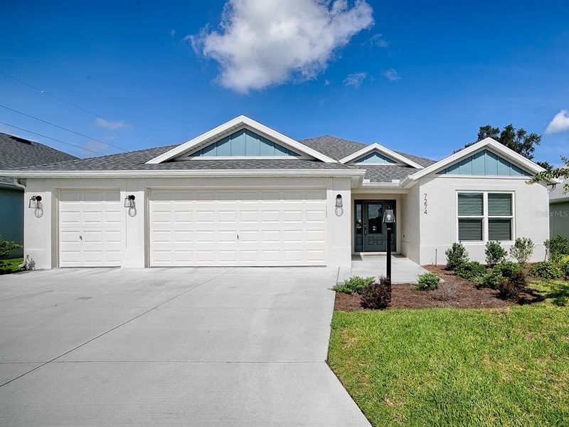 Front exterior of a new home in , The Villages, FL, highlighting curb appeal (Image 2). Front exterior of a new home in , The Villages, FL, highlighting curb appeal (Image 2).