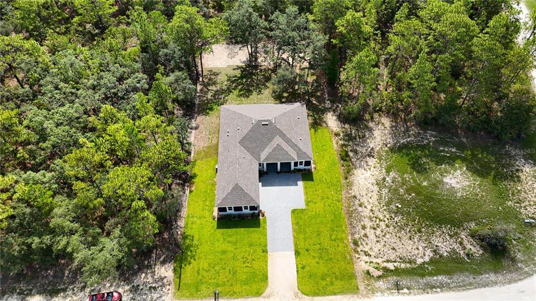 Front exterior of a new home in , Weeki Wachee, FL, highlighting curb appeal (Image 38).