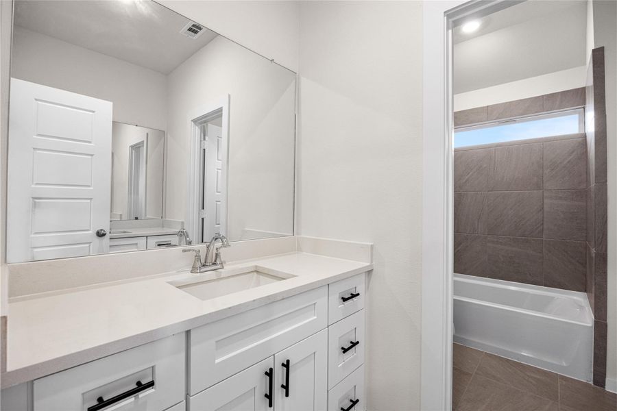 Furnished interior view inside a new home in Creekhaven, Iowa Colony (Image 11).
