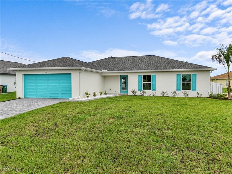 Front exterior of a new home in Cape Coral, Cape Coral, FL, highlighting curb appeal (Image 19). Front exterior of a new home in Cape Coral, Cape Coral, FL, highlighting curb appeal (Image 19).