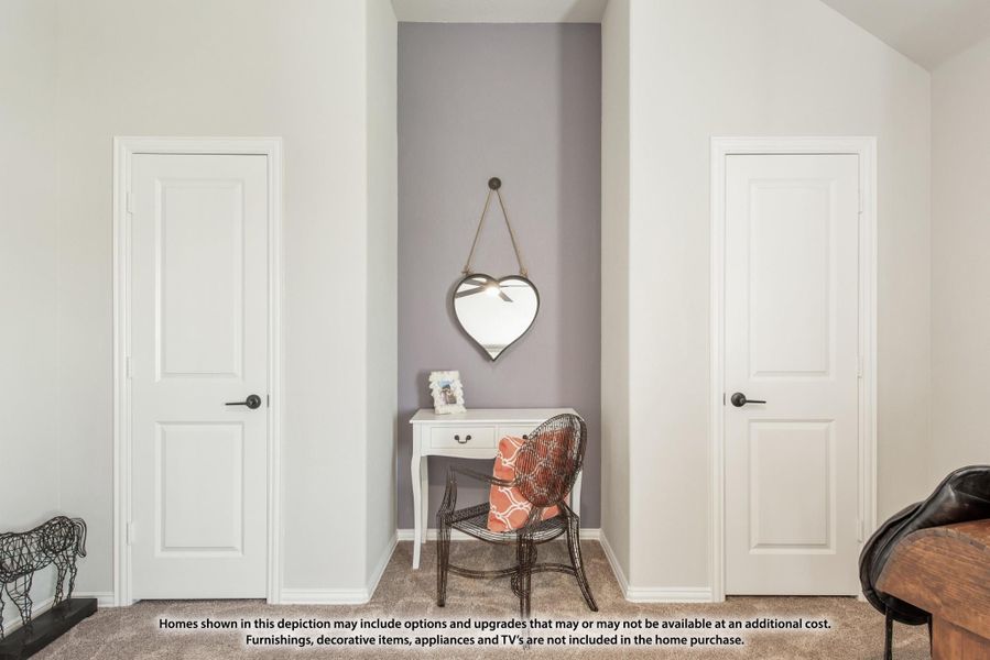 Bedroom nook with small white desk, heart-shaped mirror, and two white panel doors on either side Bedroom nook with small white desk, heart-shaped mirror, and two white panel doors on either side