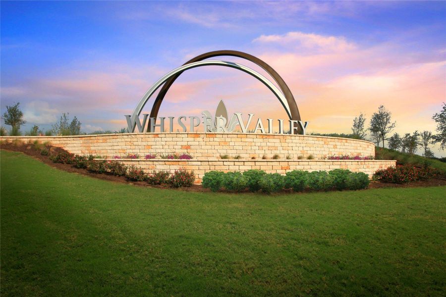 Community / neighborhood sign featuring a lawn Community / neighborhood sign featuring a lawn