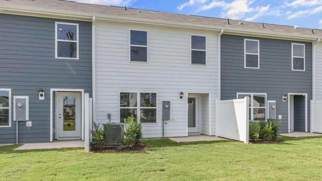 Exterior details and patio area of a home in The Townes at Hunter Hill, Rocky Mount (Image 4).