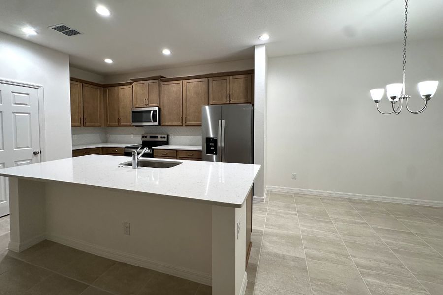 Furnished interior view inside a new home in Trinity Gardens, Deland (Image 6).