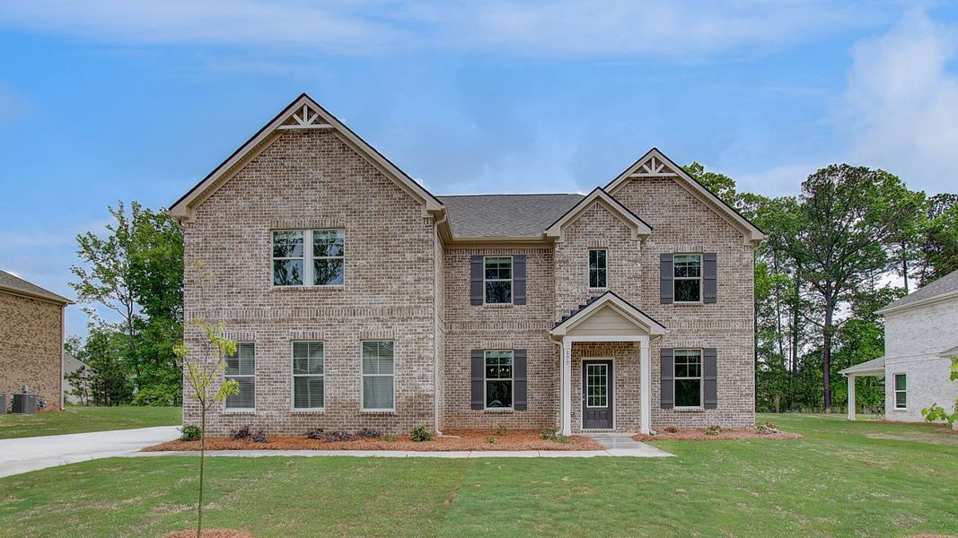 Representative exterior photo of a completed home built from the McKinley by DRB Homes in Cambria at Traditions, Hampton, GA (Image 23).