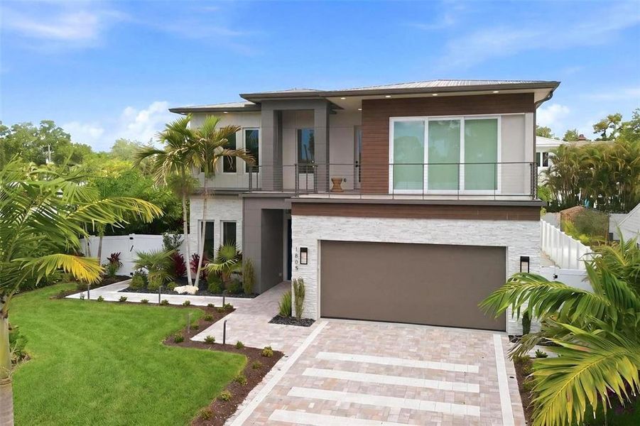 Front exterior of a new home in , Sarasota, FL, highlighting curb appeal (Image 2). Front exterior of a new home in , Sarasota, FL, highlighting curb appeal (Image 2).