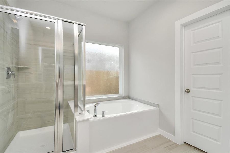 Discover another perspective of the beautiful primary bathroom.