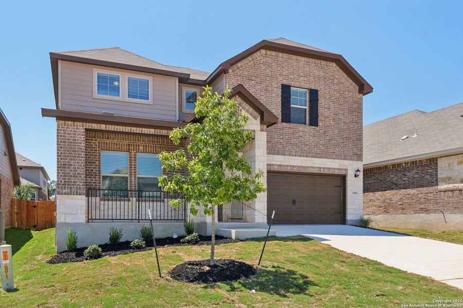 Front exterior of a new home in Fox Falls, Boerne, TX, highlighting curb appeal (Image 24).
