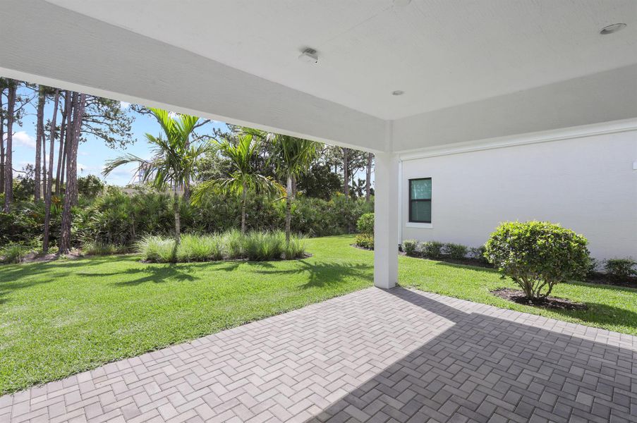 Exterior details and patio area of a home in Artistry Palm Beach, Palm Beach Gardens (Image 2).