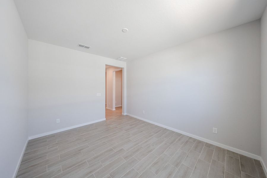 A room with a wood floor and a wood floor.