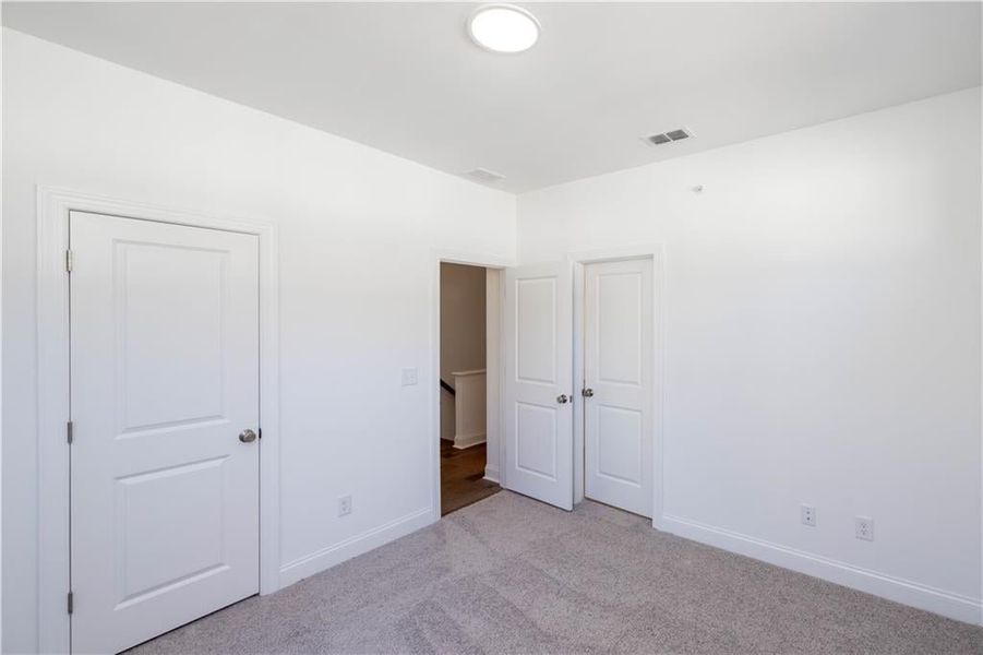 This secondary bedroom is connected to the hall bath.