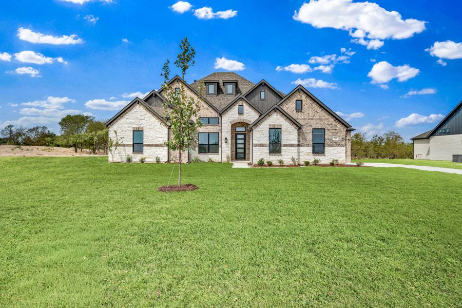 Front exterior of a new home in Legacy Trails, McLendon-Chisholm, TX, highlighting curb appeal (Image 15).
