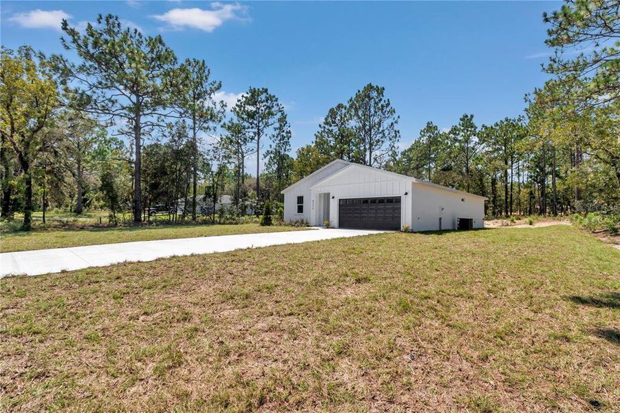 Front exterior of a new home in , Dunnellon, FL, highlighting curb appeal (Image 27).
