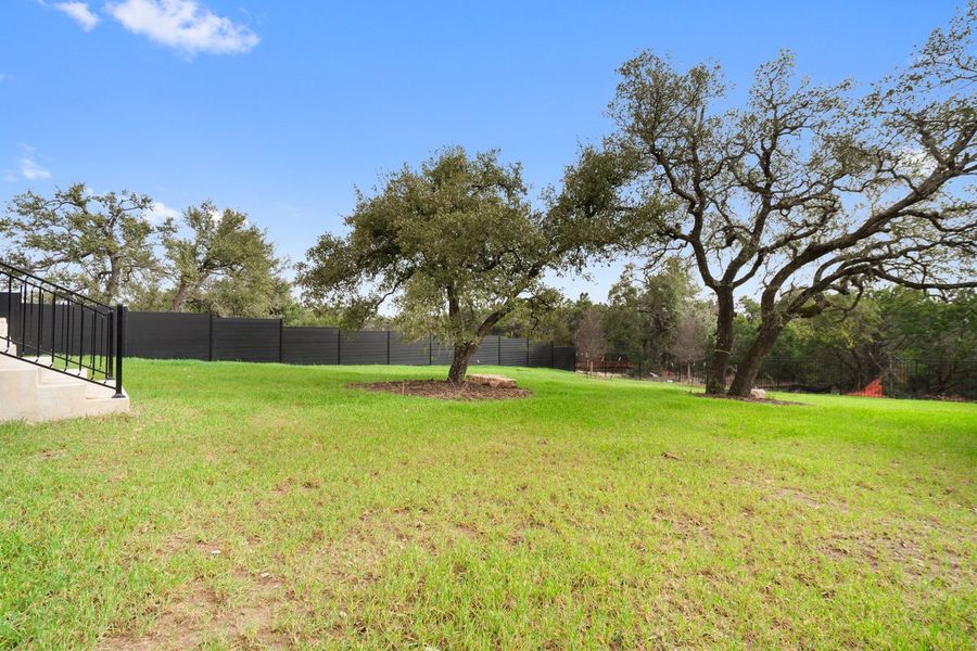 Exterior details and patio area of a home in Milky Way at River Place, Austin (Image 5).
