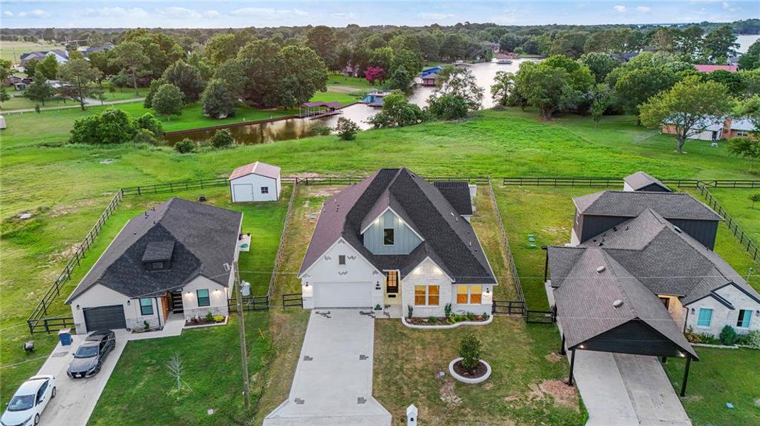 Aerial view of property and surrounding area featuring a large body of water Aerial view of property and surrounding area featuring a large body of water