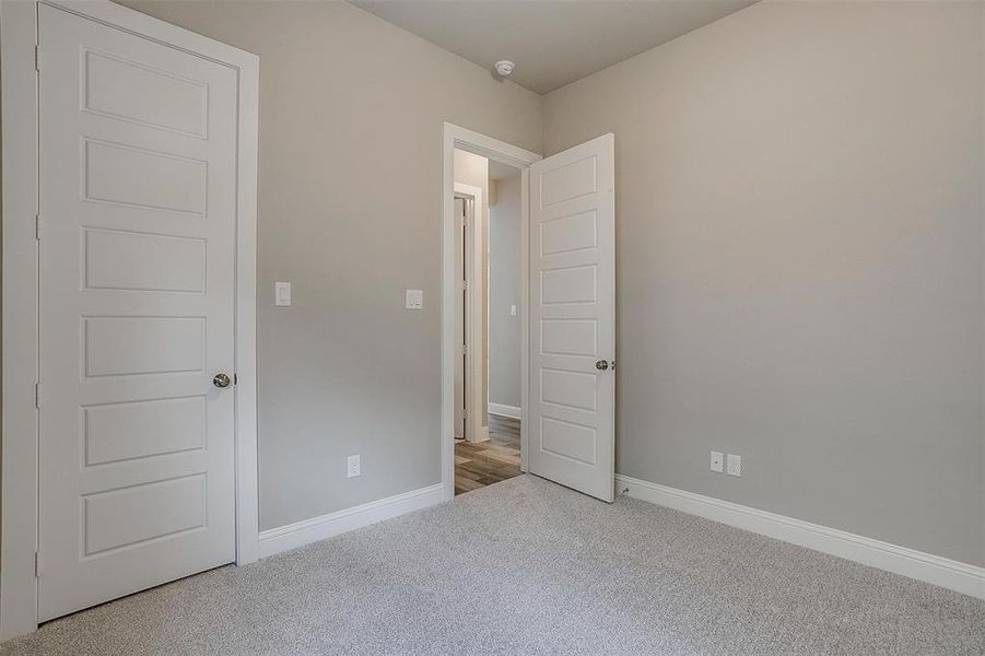 Unfurnished bedroom with carpet