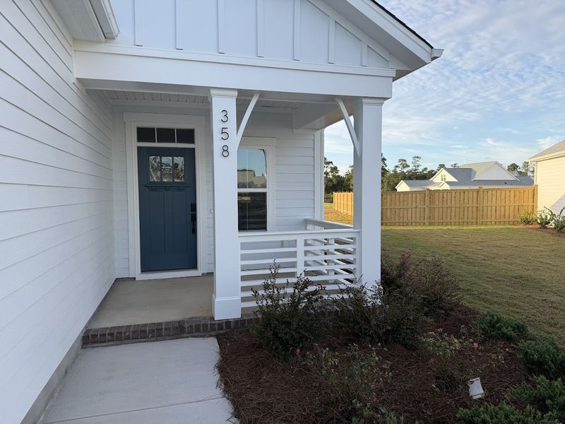 Exterior details and patio area of a home in Songbird, Hampstead (Image 2).