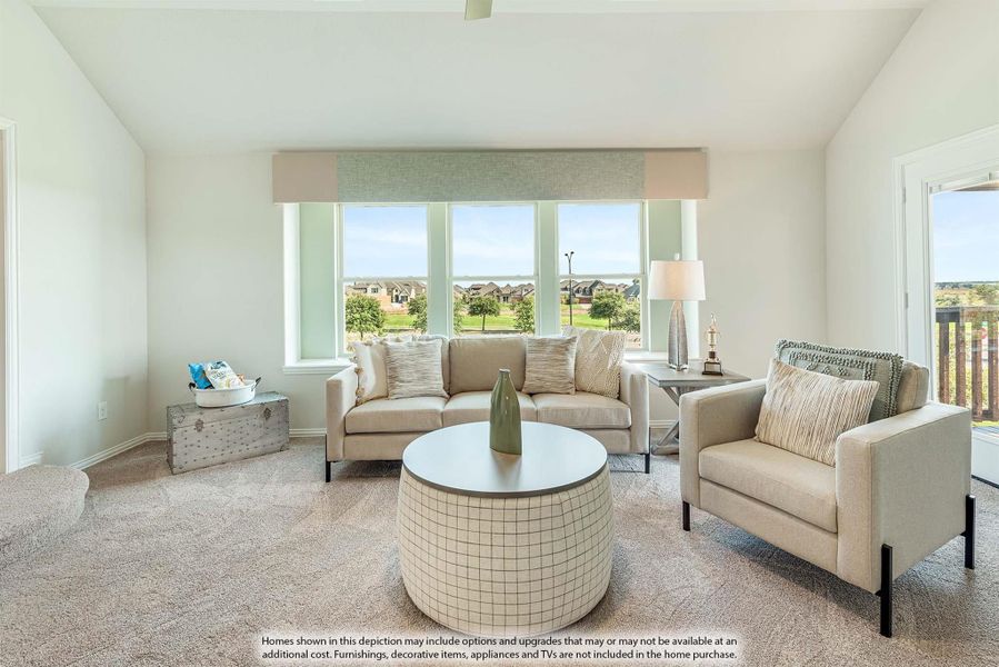 Living room with neutral sofa, armchair, round coffee table, carpet, and large windows overlooking a neighborhood.