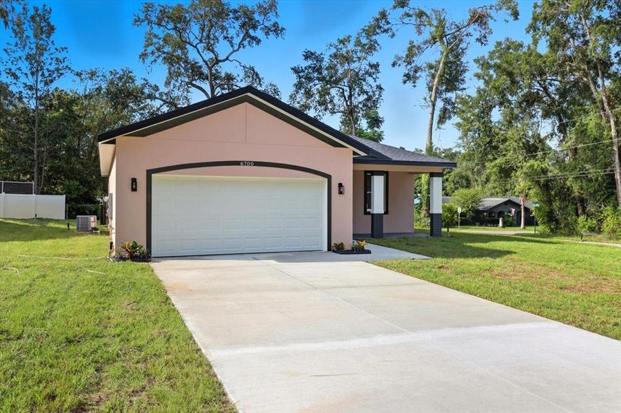 Front exterior of a new home in , Inverness, FL, highlighting curb appeal (Image 20).