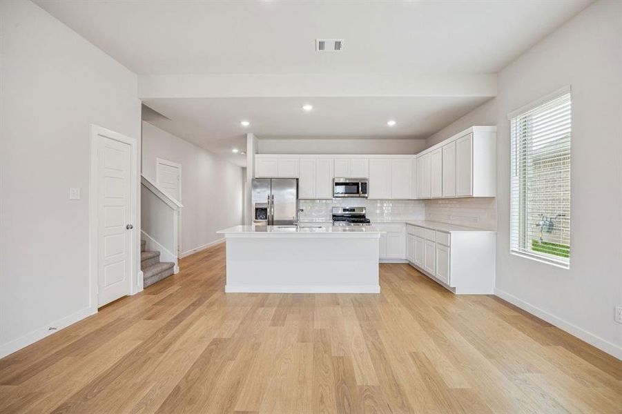 Kitchen in the Stanley II home plan by Trophy Signature Homes – REPRESENTATIVE PHOTO