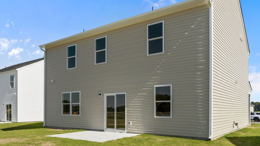Exterior details and patio area of a home in East Ridge, Ayden (Image 2).