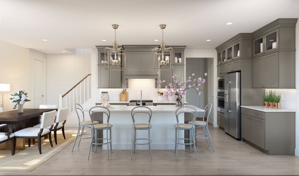 Kitchen features a central island with space for prep & dining