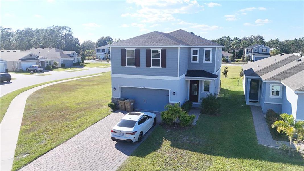Front exterior of a new home in , Clermont, FL, highlighting curb appeal (Image 28). Front exterior of a new home in , Clermont, FL, highlighting curb appeal (Image 28).