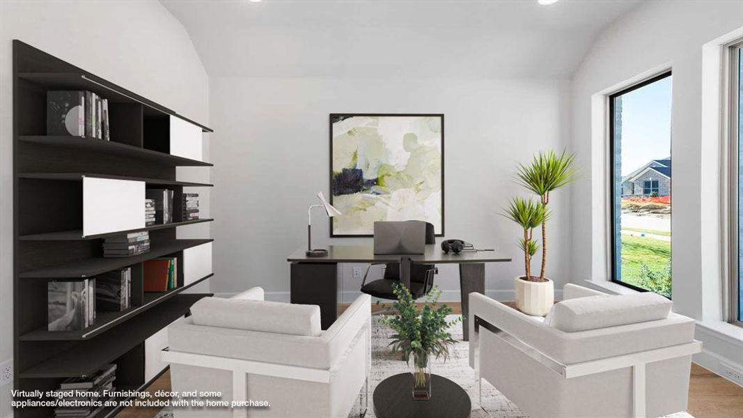 Office area featuring light wood-type flooring and lofted ceiling