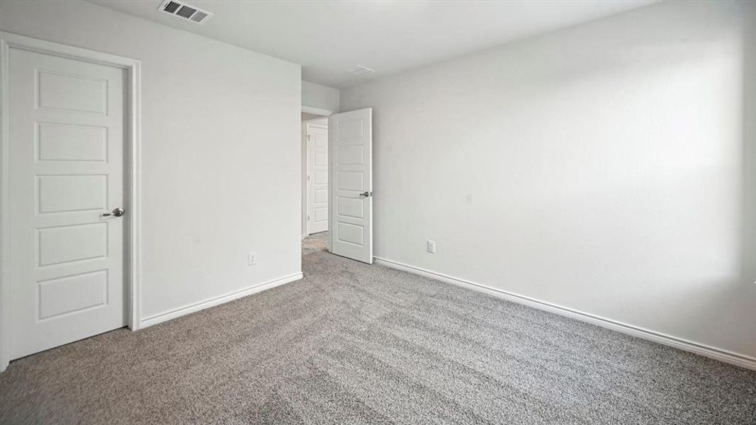Unfurnished bedroom featuring carpet and baseboards Unfurnished bedroom featuring carpet and baseboards