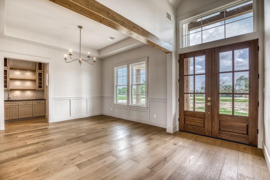 Entry foyer with dining room. Dry bar in the back hallway.