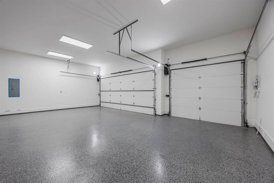 Garage with electric panel and baseboards Garage with electric panel and baseboards