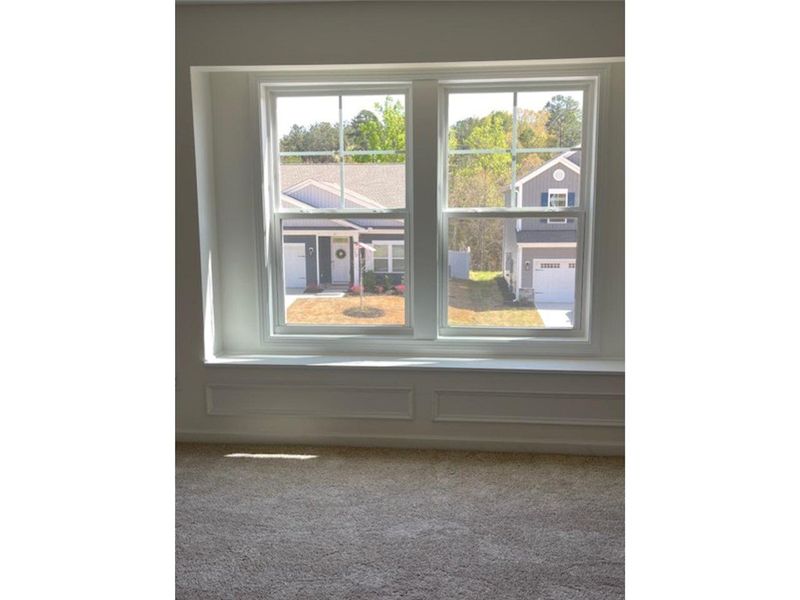 This bright room features elegant trim and a welco