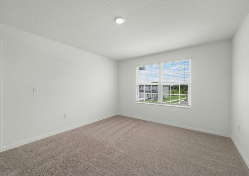 Upstairs master bedroom with a large window
