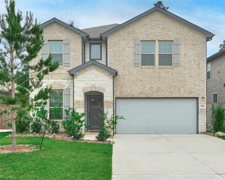 Front exterior of a new home in The Pines At Seven Coves, Willis, TX, highlighting curb appeal (Image 21).